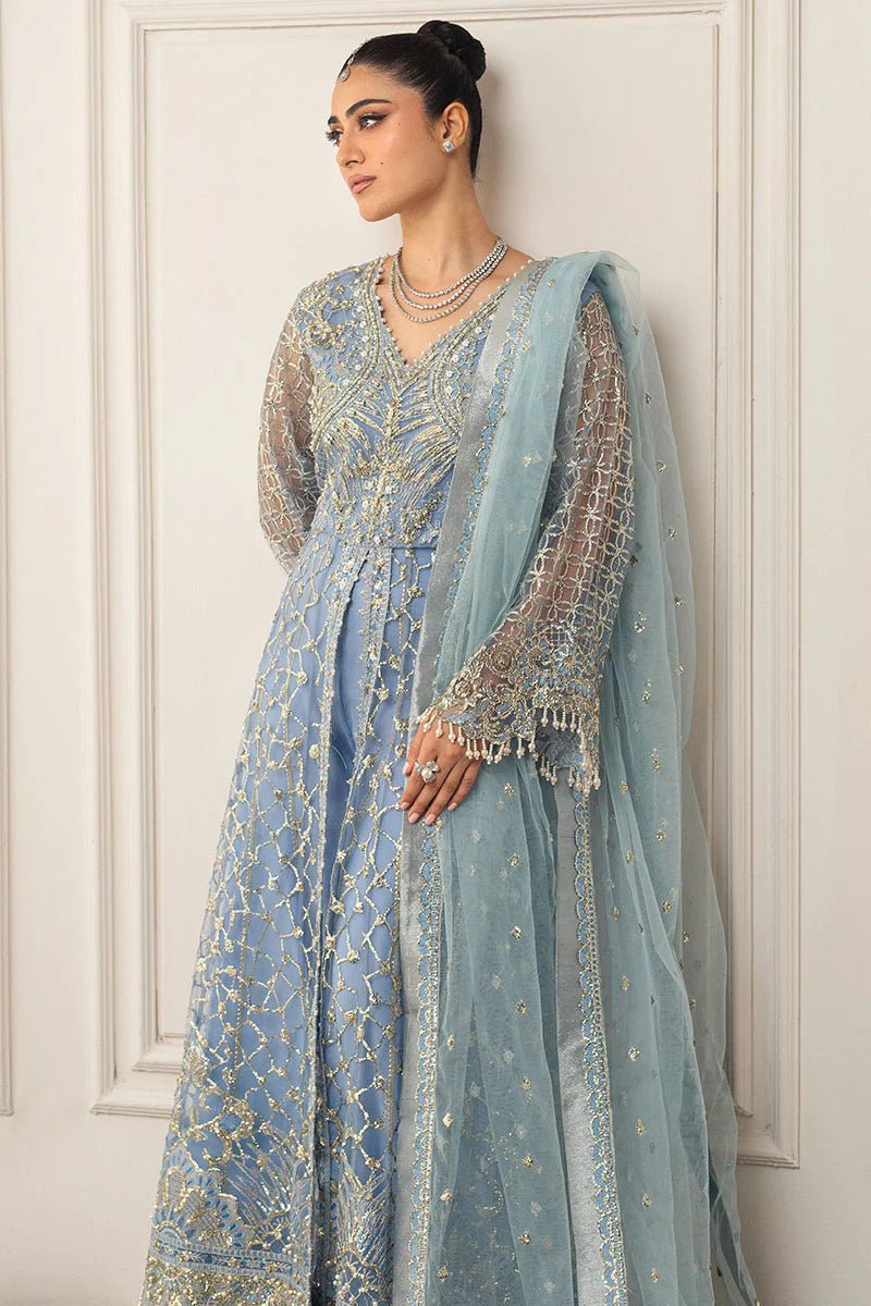 Model wearing a light blue embellished wedding formal dress, "Periwinkle," from Mushq. Pakistani wedding clothes online in the UK.