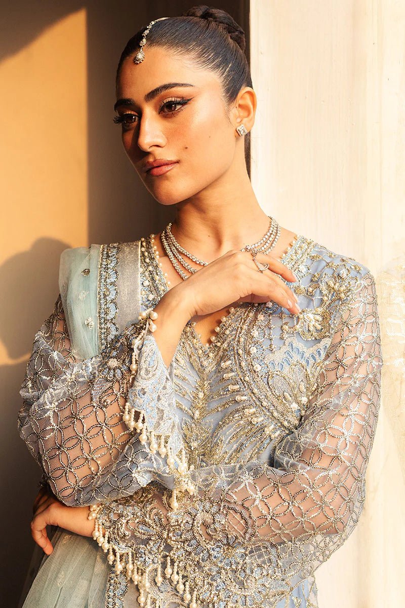 Model wearing a light blue embellished wedding formal dress, "Periwinkle," from Mushq. Pakistani wedding clothes online in the UK.