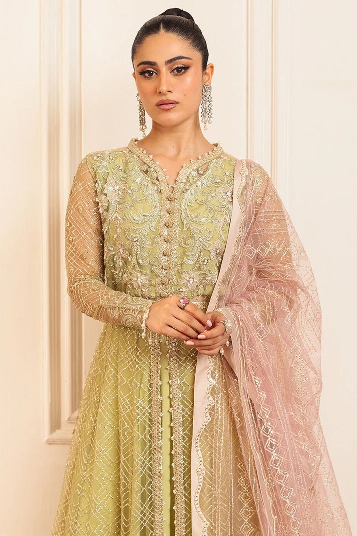 Model wearing a pastel green wedding formal dress, Wasabi, from Mushq. Pakistani wedding clothes online in the UK.