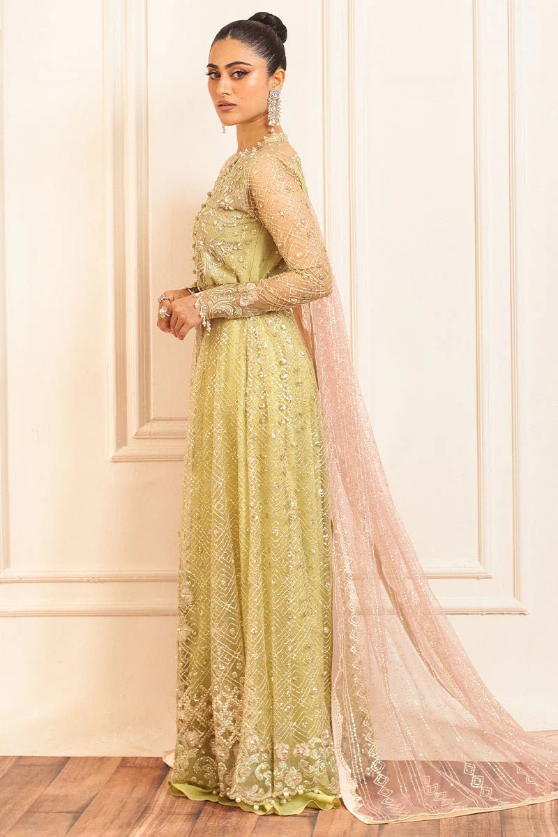 Model wearing a pastel green wedding formal dress, Wasabi, from Mushq. Pakistani wedding clothes online in the UK.