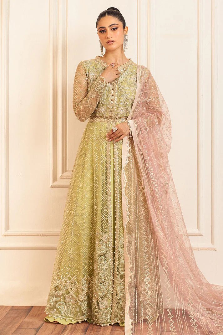 Model wearing a pastel green wedding formal dress, Wasabi, from Mushq. Pakistani wedding clothes online in the UK.