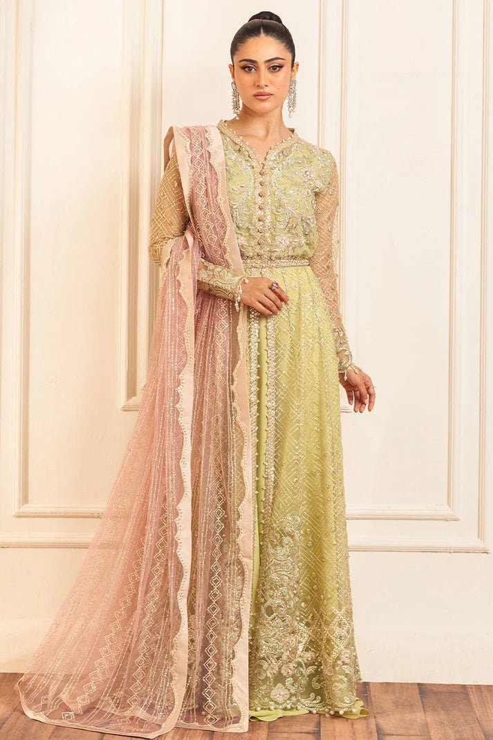 Model wearing a pastel green wedding formal dress, Wasabi, from Mushq. Pakistani wedding clothes online in the UK.