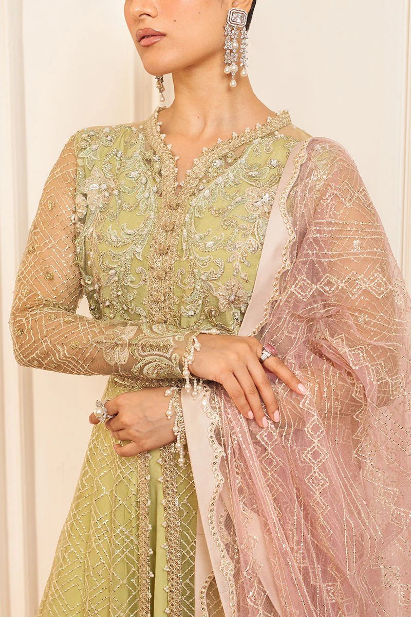 Model wearing a pastel green wedding formal dress, Wasabi, from Mushq. Pakistani wedding clothes online in the UK.