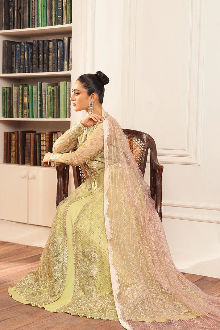 Model wearing a pastel green wedding formal dress, Wasabi, from Mushq. Pakistani wedding clothes online in the UK.