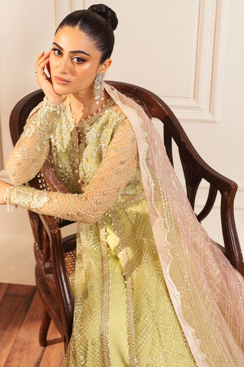 Model wearing a pastel green wedding formal dress, Wasabi, from Mushq. Pakistani wedding clothes online in the UK.