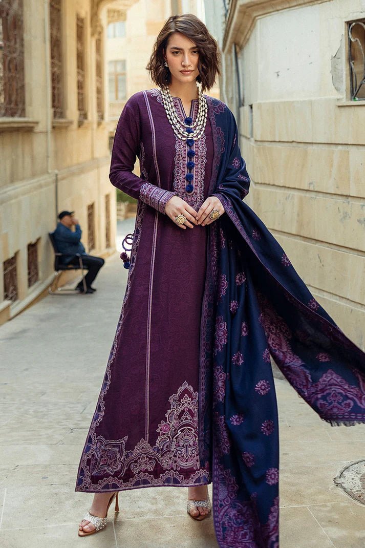 Model wearing Mushq Broadway A Walk to Remember Endless Passion, a deep purple dress with intricate embroidery and a navy patterned shawl, ideal for winter casual wear. Available for Pakistani clothes online in the UK.