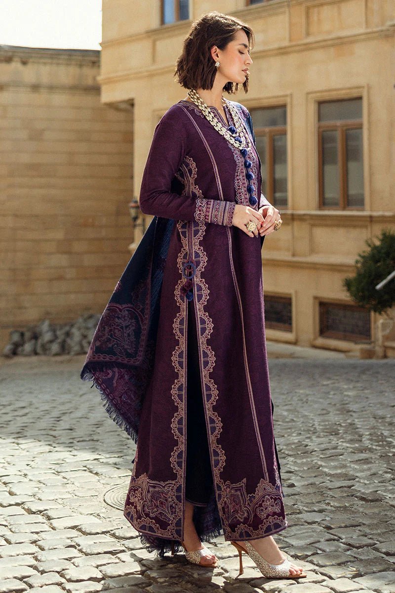 Model wearing Mushq Broadway A Walk to Remember Endless Passion, a deep purple dress with intricate embroidery and a navy patterned shawl, ideal for winter casual wear. Available for Pakistani clothes online in the UK.