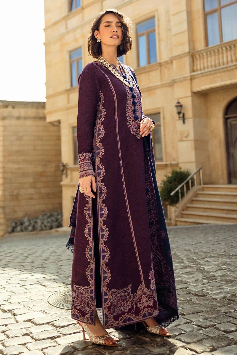 Model wearing Mushq Broadway A Walk to Remember Endless Passion, a deep purple dress with intricate embroidery and a navy patterned shawl, ideal for winter casual wear. Available for Pakistani clothes online in the UK.