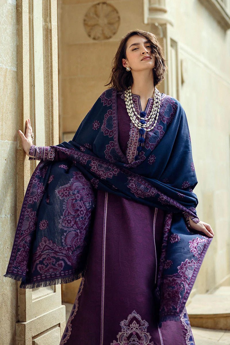 Model wearing Mushq Broadway A Walk to Remember Endless Passion, a deep purple dress with intricate embroidery and a navy patterned shawl, ideal for winter casual wear. Available for Pakistani clothes online in the UK.