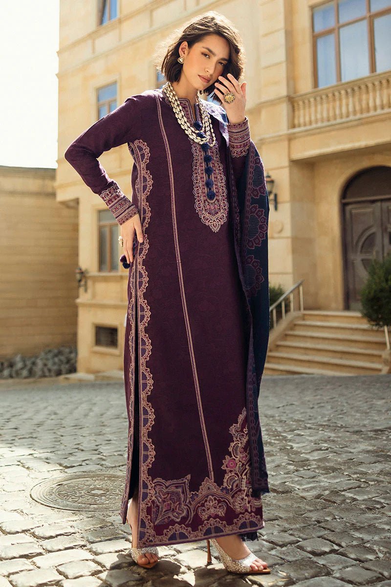 Model wearing Mushq Broadway A Walk to Remember Endless Passion, a deep purple dress with intricate embroidery and a navy patterned shawl, ideal for winter casual wear. Available for Pakistani clothes online in the UK.