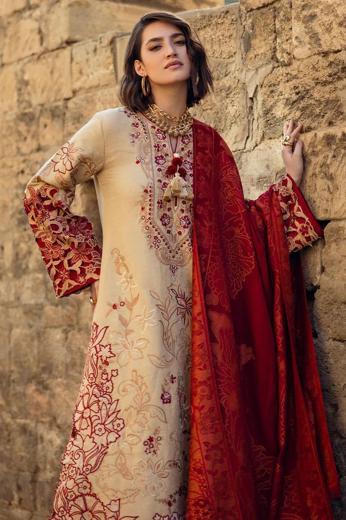 Model wearing Mushq Broadway A Walk to Remember Fallen Hearts, a beige dress with red floral embroidery and matching red shawl, perfect for winter casual wear. Available for Pakistani clothes online in the UK.