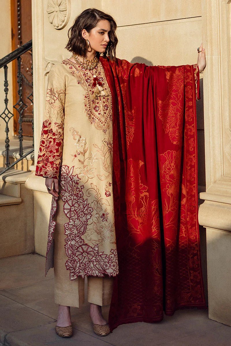 Model wearing Mushq Broadway A Walk to Remember Fallen Hearts, a beige dress with red floral embroidery and matching red shawl, perfect for winter casual wear. Available for Pakistani clothes online in the UK.