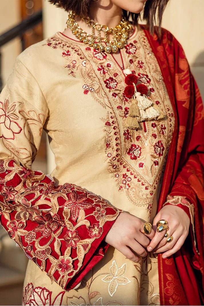 Model wearing Mushq Broadway A Walk to Remember Fallen Hearts, a beige dress with red floral embroidery and matching red shawl, perfect for winter casual wear. Available for Pakistani clothes online in the UK.