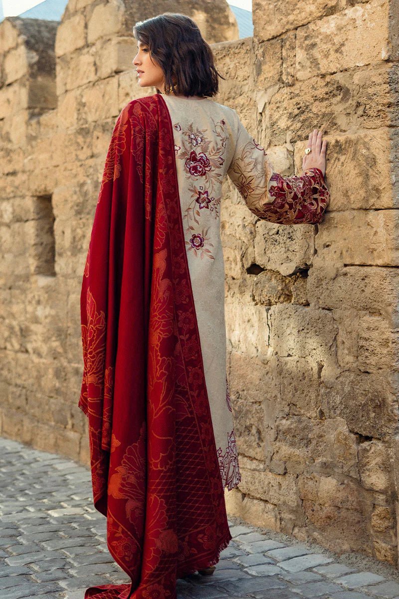 Model wearing Mushq Broadway A Walk to Remember Fallen Hearts, a beige dress with red floral embroidery and matching red shawl, perfect for winter casual wear. Available for Pakistani clothes online in the UK.