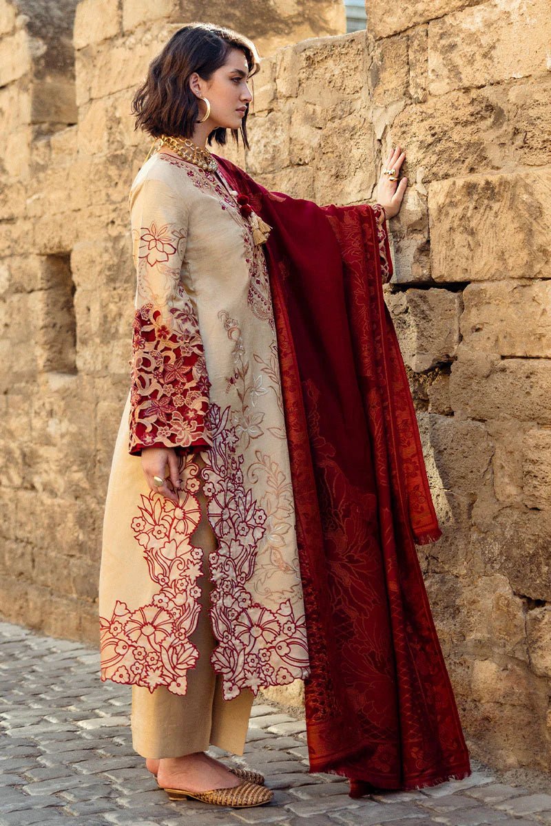 Model wearing Mushq Broadway A Walk to Remember Fallen Hearts, a beige dress with red floral embroidery and matching red shawl, perfect for winter casual wear. Available for Pakistani clothes online in the UK.