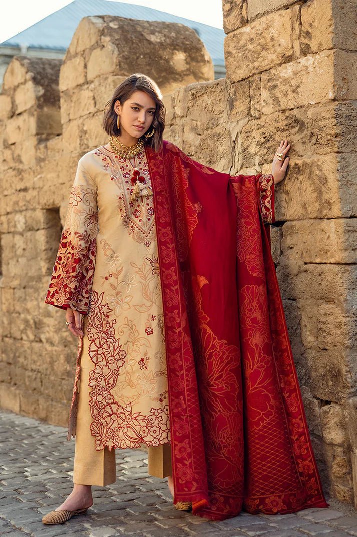 Model wearing Mushq Broadway A Walk to Remember Fallen Hearts, a beige dress with red floral embroidery and matching red shawl, perfect for winter casual wear. Available for Pakistani clothes online in the UK.