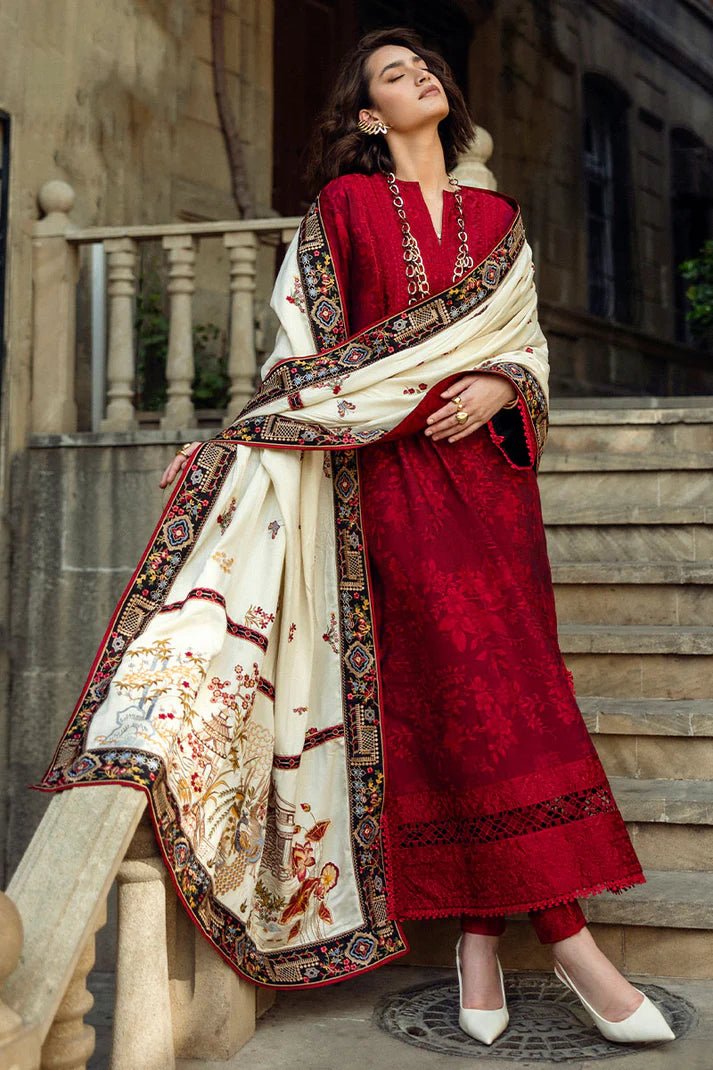 Model wearing Mushq Broadway A Walk to Remember Flying Kiss, a rich red dress with intricate patterns and a cream shawl, ideal for winter casual wear. Available for Pakistani clothes online in the UK.