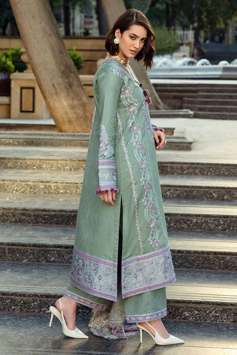 Model wearing Mushq Broadway A Walk to Remember Sweet Union, a sage green dress with intricate lavender embroidery, ideal for winter casual pret. Available for Pakistani clothes online in the UK.