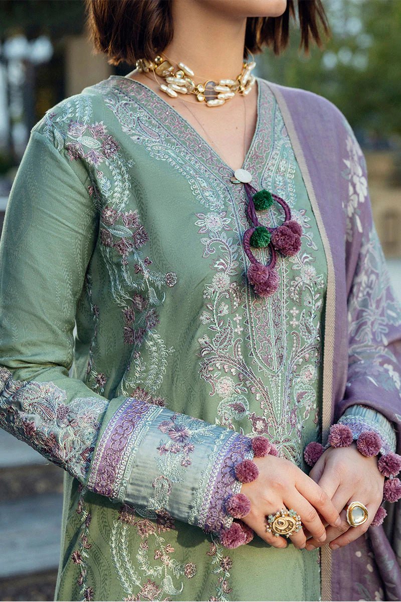 Model wearing Mushq Broadway A Walk to Remember Sweet Union, a sage green dress with intricate lavender embroidery, ideal for winter casual pret. Available for Pakistani clothes online in the UK.