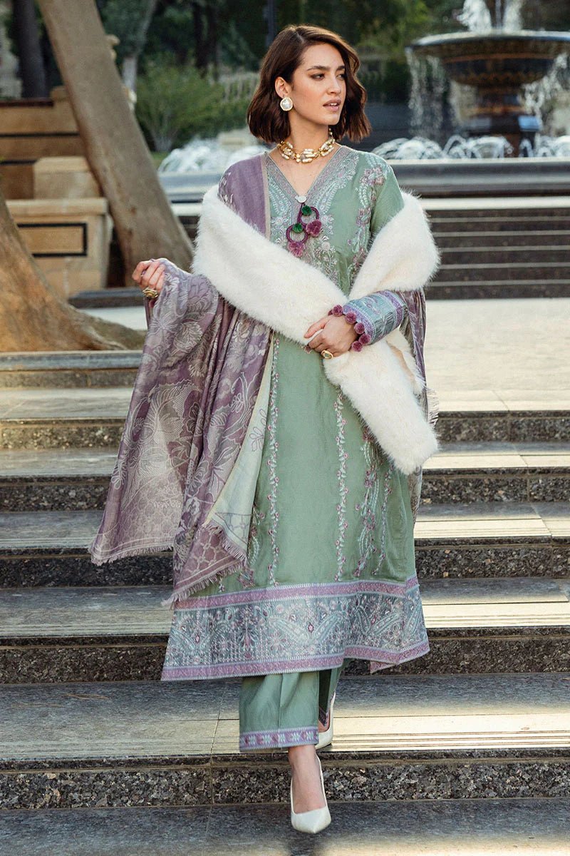 Model wearing Mushq Broadway A Walk to Remember Sweet Union, a sage green dress with intricate lavender embroidery, ideal for winter casual pret. Available for Pakistani clothes online in the UK.