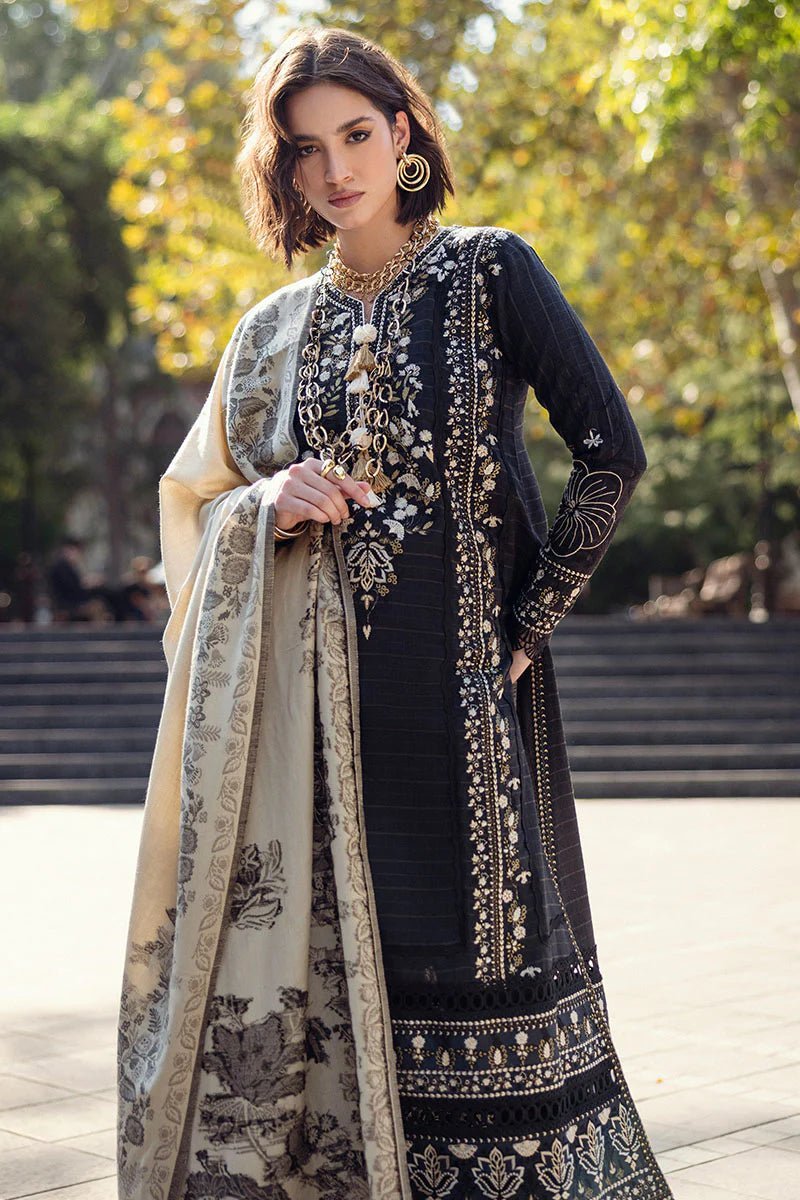 Model wearing Mushq Broadway A Walk to Remember Twisted Affection, a navy dress with intricate embroidery and a beige printed shawl, ideal for winter casual wear. Available for Pakistani clothes online in the UK.