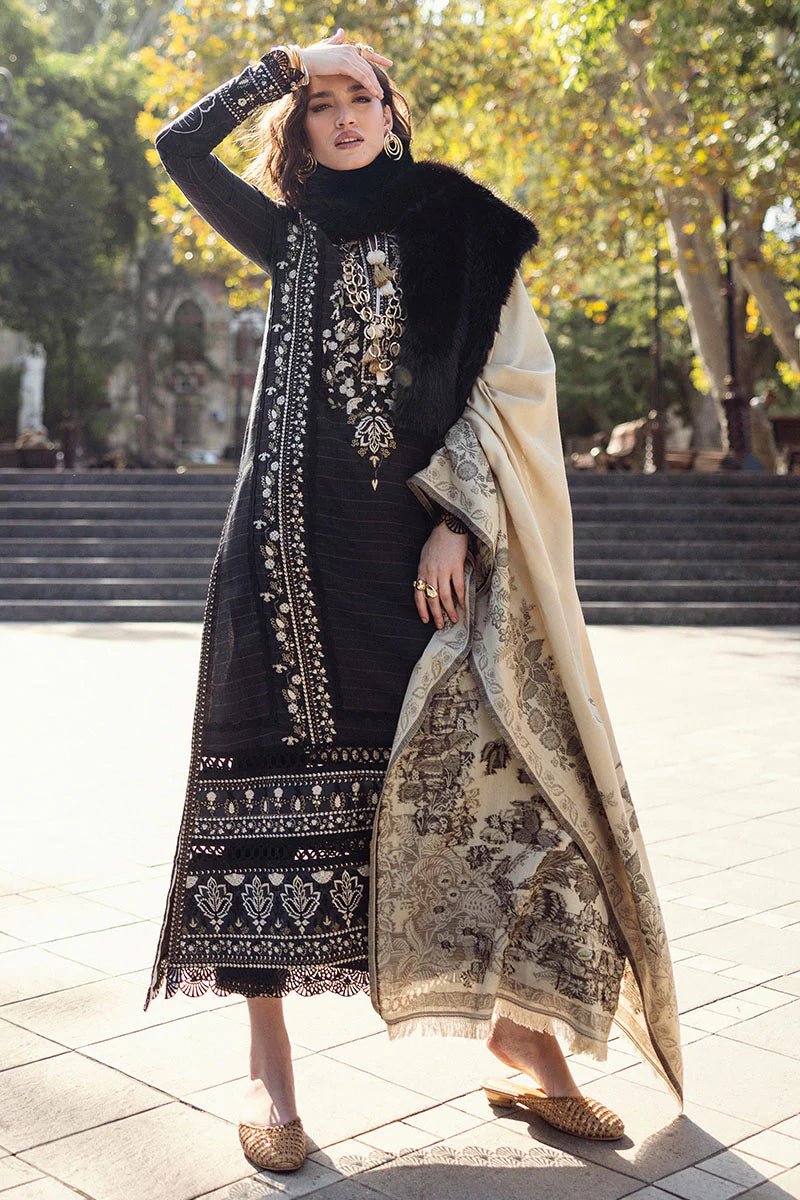 Model wearing Mushq Broadway A Walk to Remember Twisted Affection, a navy dress with intricate embroidery and a beige printed shawl, ideal for winter casual wear. Available for Pakistani clothes online in the UK.