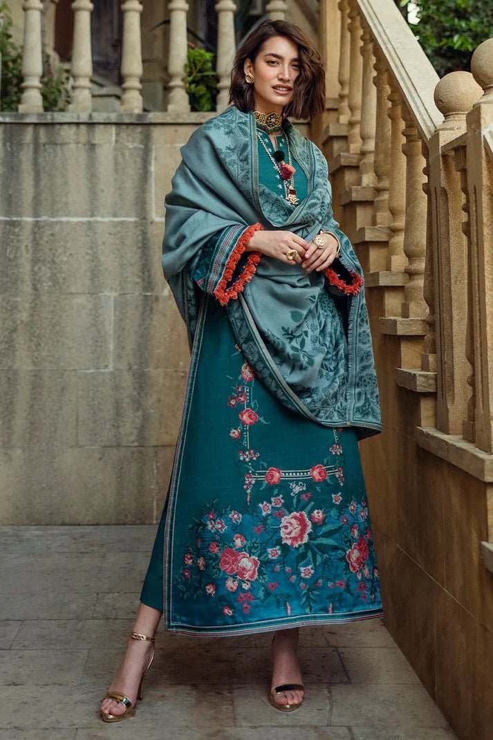 Model wearing Mushq Broadway A Walk to Remember Whispered Secrets, a teal dress adorned with floral embroidery and tassel accents, perfect for winter casual wear. Available for Pakistani clothes online in the UK.