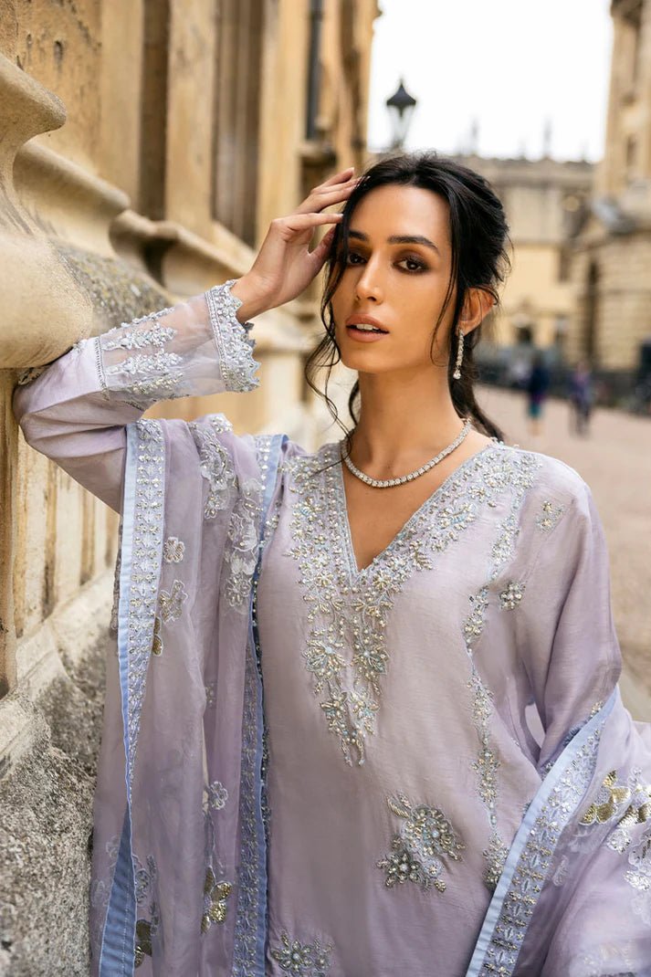 Model wearing pastel lilac dress with intricate silver and floral embroidery from Mushq, part of the Celestine The Oxford Edit 24 collection, named Asteria. Ideal for Pakistani wedding clothes online in the UK.