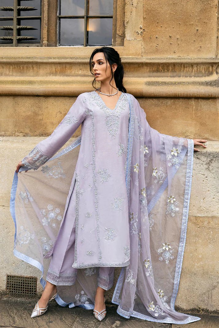 Model wearing pastel lilac dress with intricate silver and floral embroidery from Mushq, part of the Celestine The Oxford Edit 24 collection, named Asteria. Ideal for Pakistani wedding clothes online in the UK.