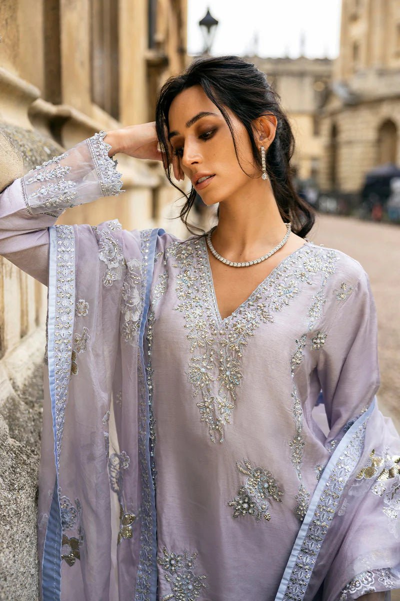 Model wearing pastel lilac dress with intricate silver and floral embroidery from Mushq, part of the Celestine The Oxford Edit 24 collection, named Asteria. Ideal for Pakistani wedding clothes online in the UK.