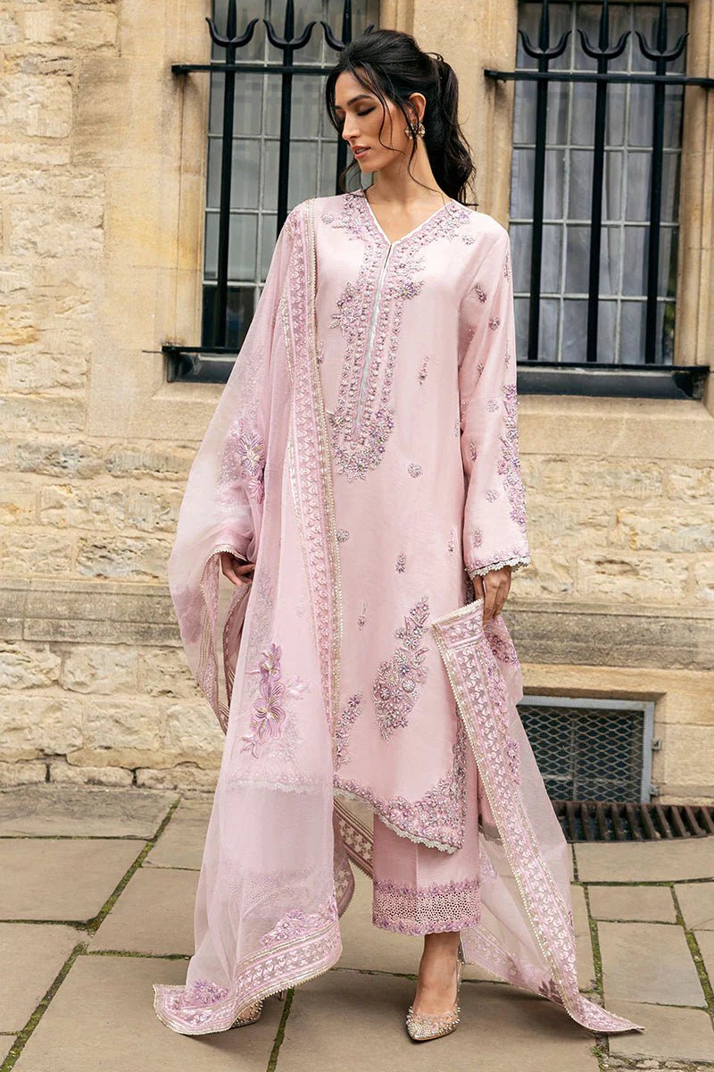 Model wearing pale pink Astrid dress from Mushq, adorned with intricate embroidery. Perfect for wedding clothes, available online in the UK.