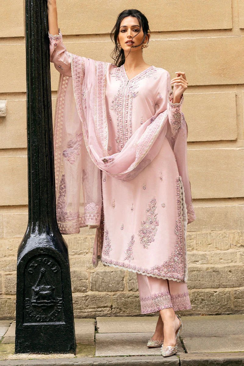 Model wearing pale pink Astrid dress from Mushq, adorned with intricate embroidery. Perfect for wedding clothes, available online in the UK.