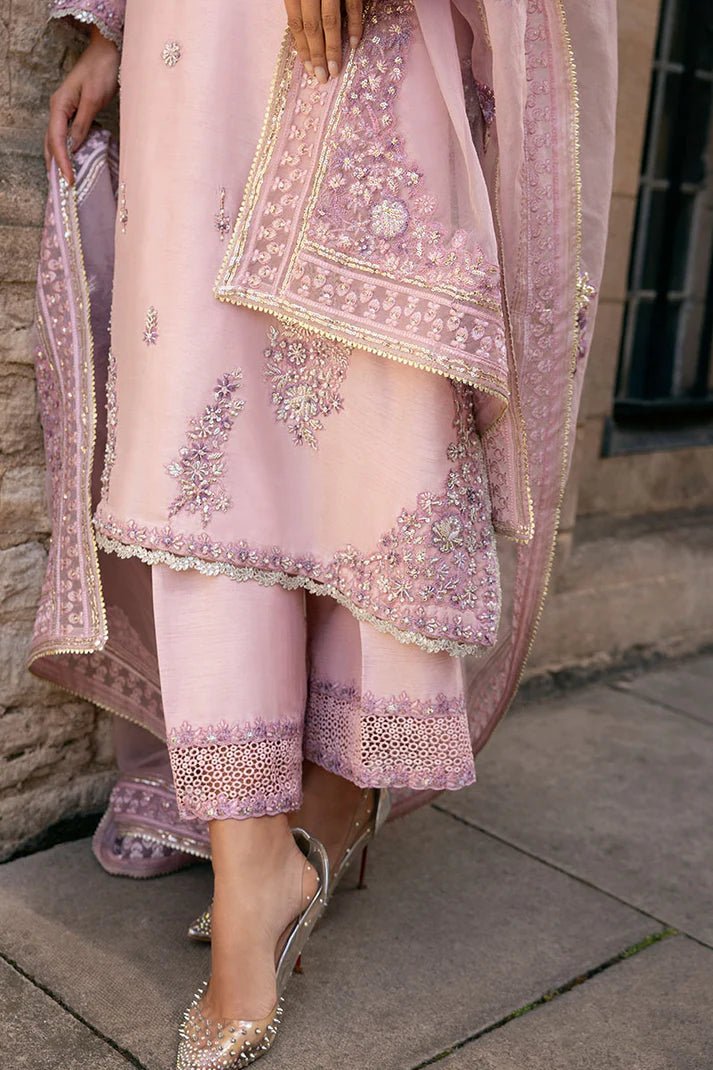 Model wearing pale pink Astrid dress from Mushq, adorned with intricate embroidery. Perfect for wedding clothes, available online in the UK.