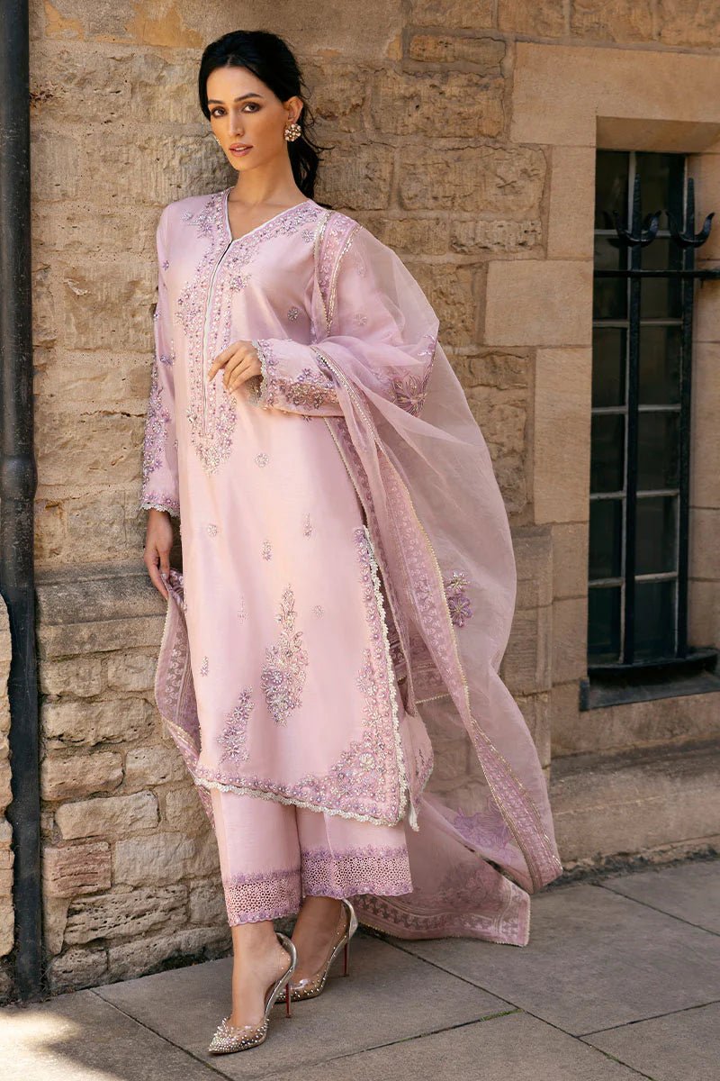 Model wearing pale pink Astrid dress from Mushq, adorned with intricate embroidery. Perfect for wedding clothes, available online in the UK.