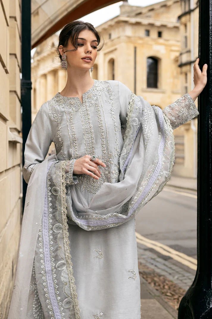 Model wearing Mushq Celestine The Oxford Edit 24 Luna Night dress in silver. Perfect for Pakistani wedding clothes online in UK.