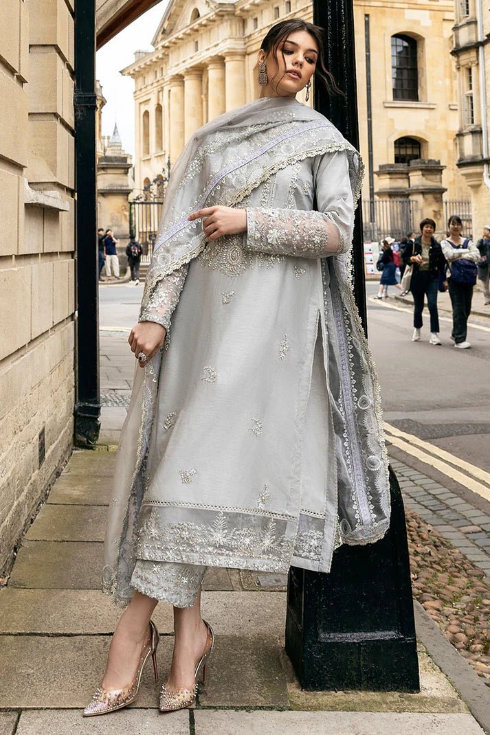 Model wearing Mushq Celestine The Oxford Edit 24 Luna Night dress in silver. Perfect for Pakistani wedding clothes online in UK.