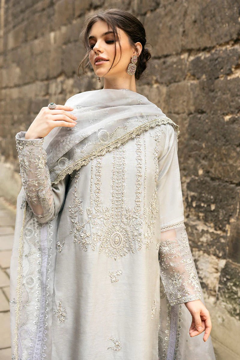 Model wearing Mushq Celestine The Oxford Edit 24 Luna Night dress in silver. Perfect for Pakistani wedding clothes online in UK.