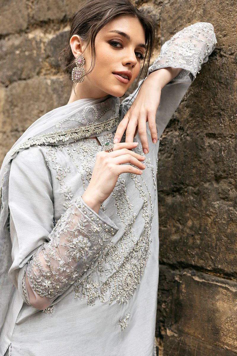 Model wearing Mushq Celestine The Oxford Edit 24 Luna Night dress in silver. Perfect for Pakistani wedding clothes online in UK.