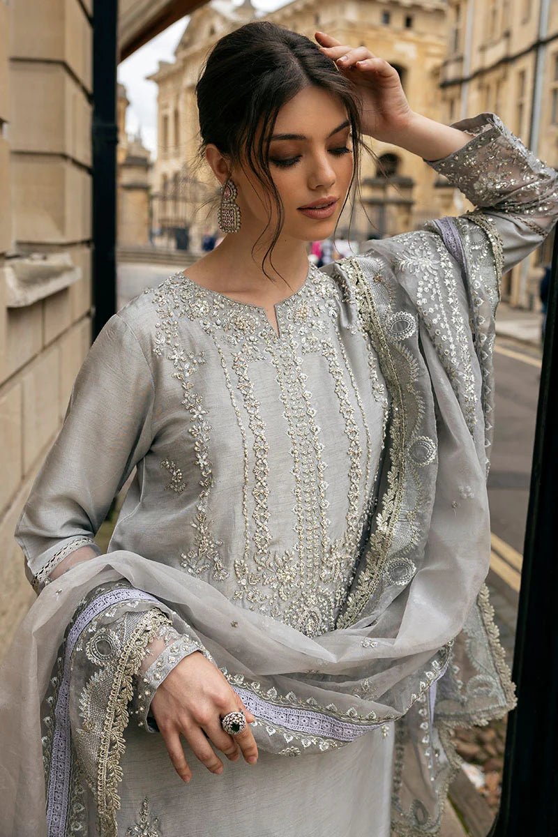 Model wearing Mushq Celestine The Oxford Edit 24 Luna Night dress in silver. Perfect for Pakistani wedding clothes online in UK.