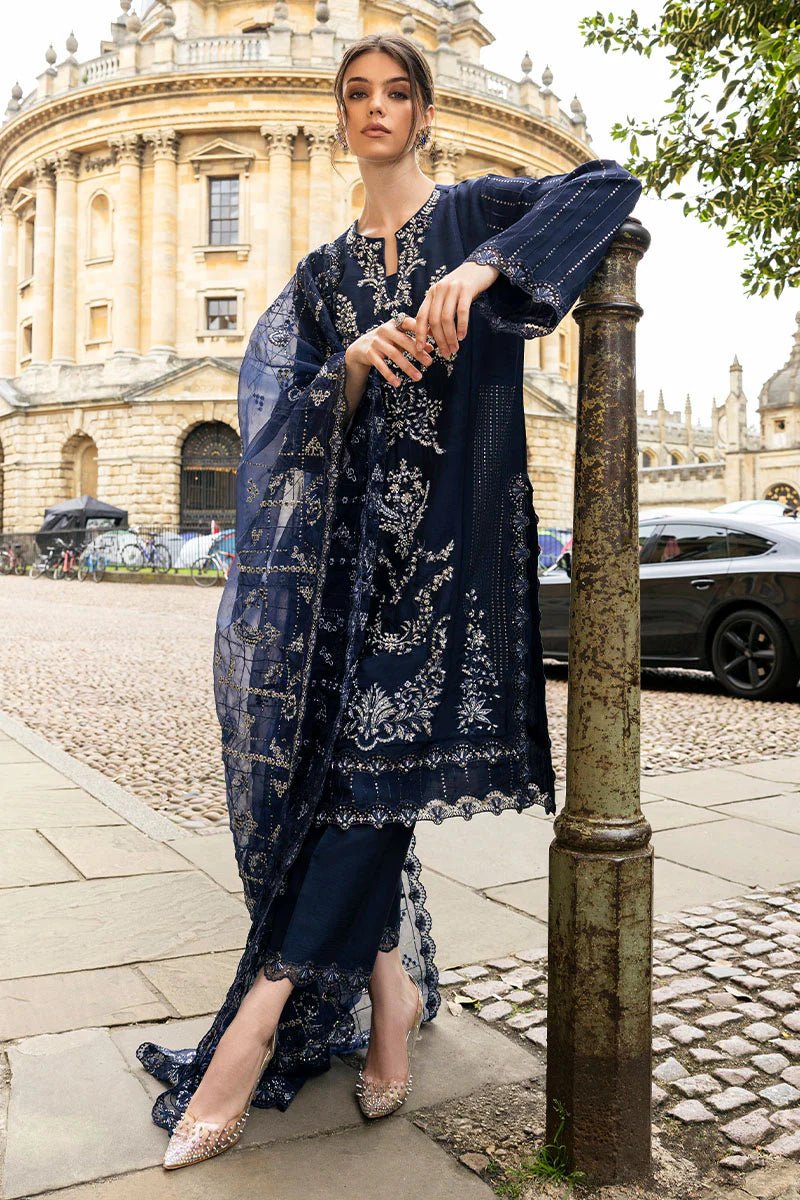 Model wearing Mushq Celestine The Oxford Edit 24 Starlight dress, featuring intricate embroidery and embellishments in a deep navy color. Perfect for wedding attire, available for Pakistani clothes online in the UK.