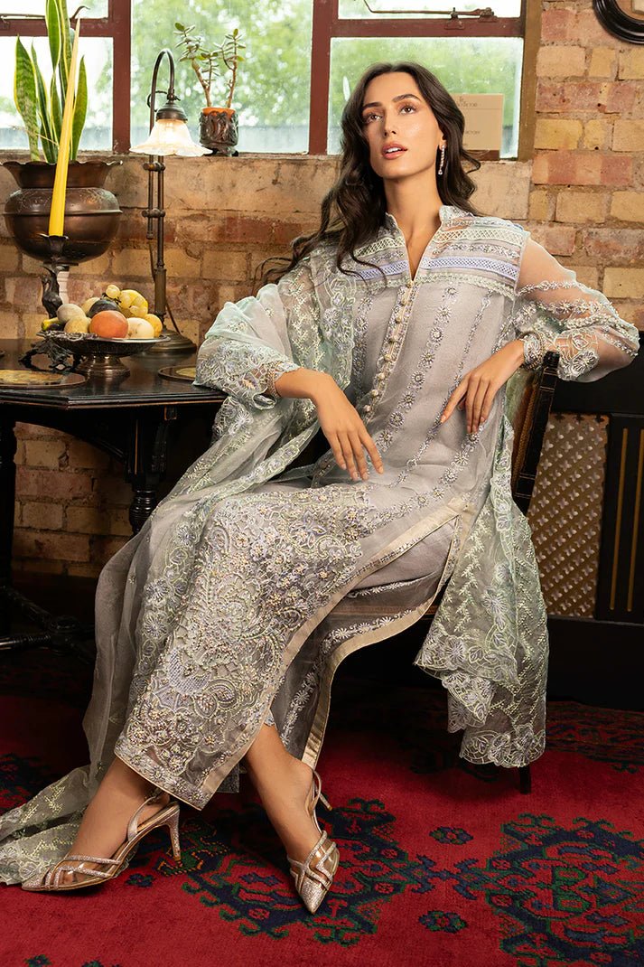 Model wearing Noelle from Mushq's Espoir Luxury Pret '24 in rich gold tones, showcasing luxury Pakistani clothes online in UK.