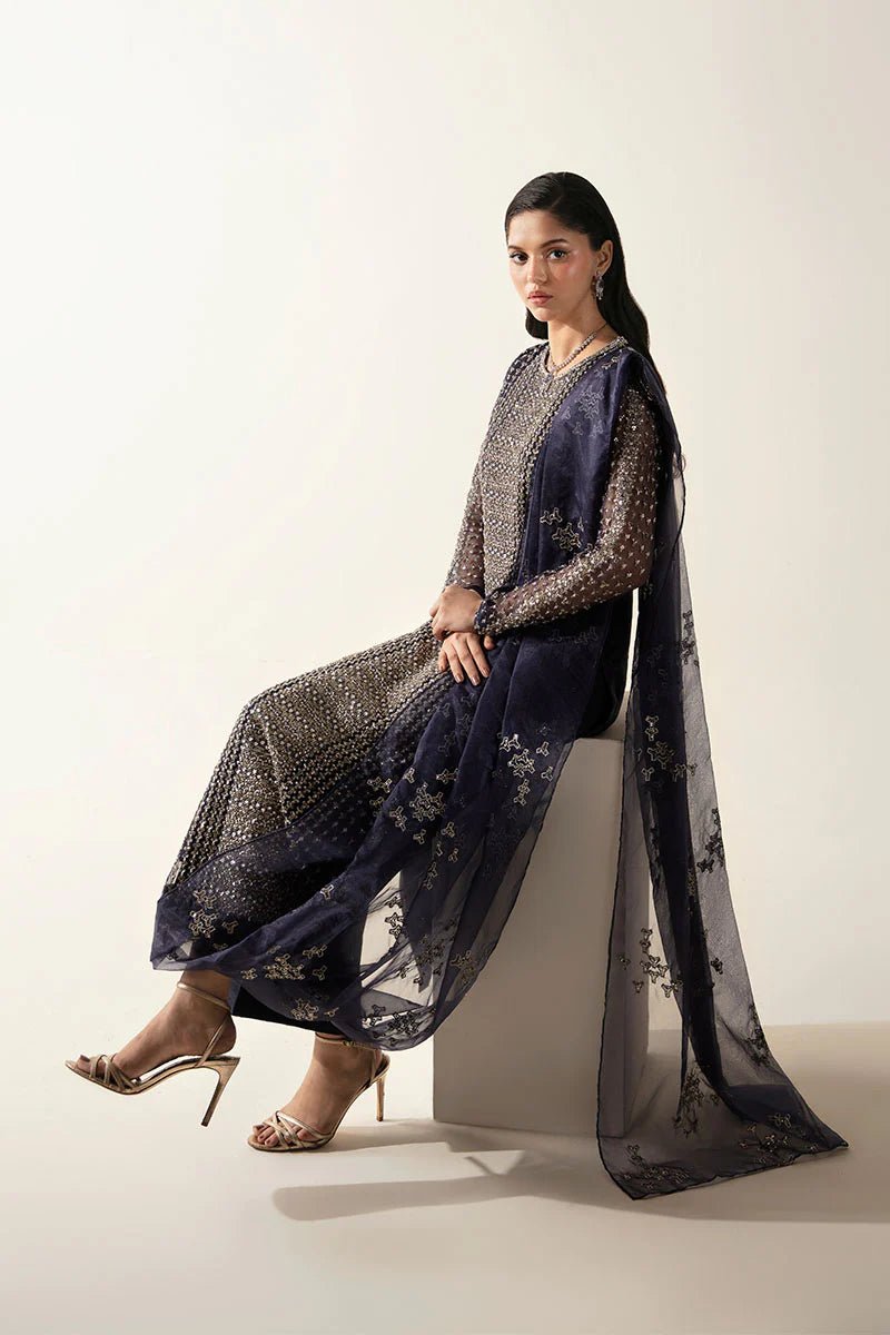 Model wearing Esma dress from Mushq's Fluer Luxury Eid Pret collection. Pakistani clothes online in UK at Signature Labels.