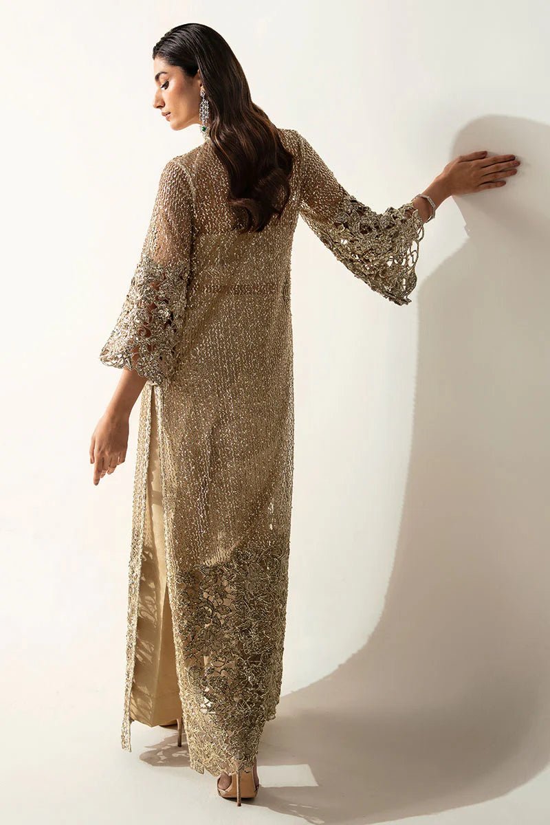 Model wearing Eve dress from Mushq's Fluer Luxury Eid Pret collection. Exquisite Pakistani clothes online in UK at Signature Labels.