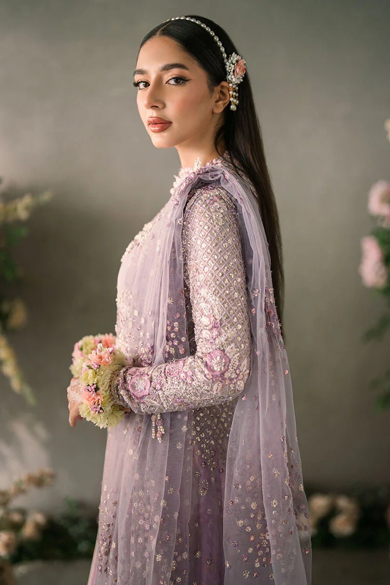 Model wearing Mushq Mastani Evening Luxury Chiffon Alyana dress in lavender, featuring intricate floral embroidery, ideal for Pakistani wedding clothes online in the UK.