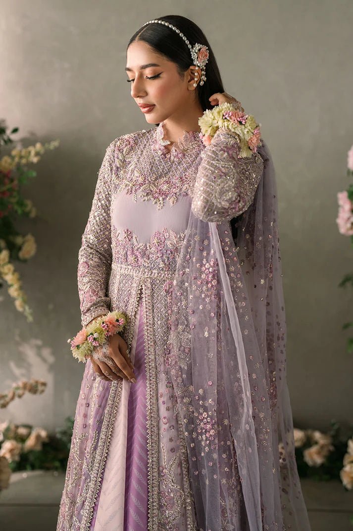 Model wearing Mushq Mastani Evening Luxury Chiffon Alyana dress in lavender, featuring intricate floral embroidery, ideal for Pakistani wedding clothes online in the UK.