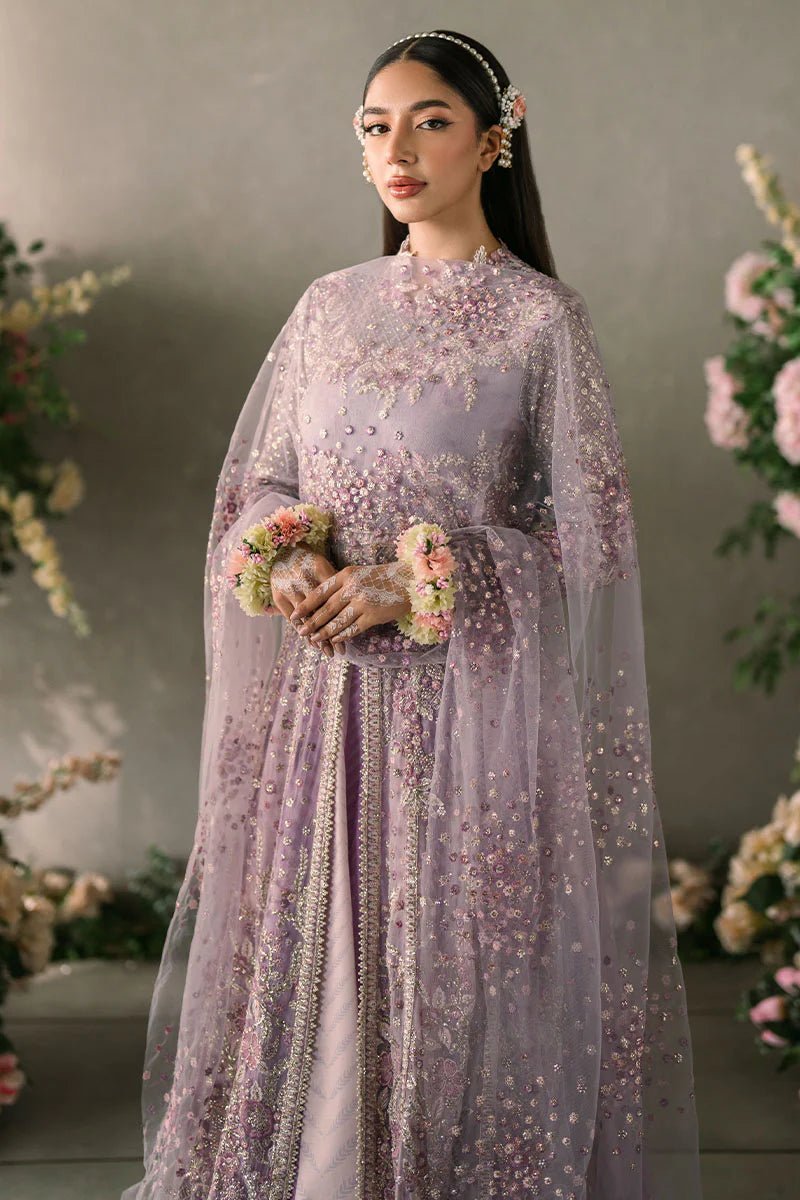 Model wearing Mushq Mastani Evening Luxury Chiffon Alyana dress in lavender, featuring intricate floral embroidery, ideal for Pakistani wedding clothes online in the UK.