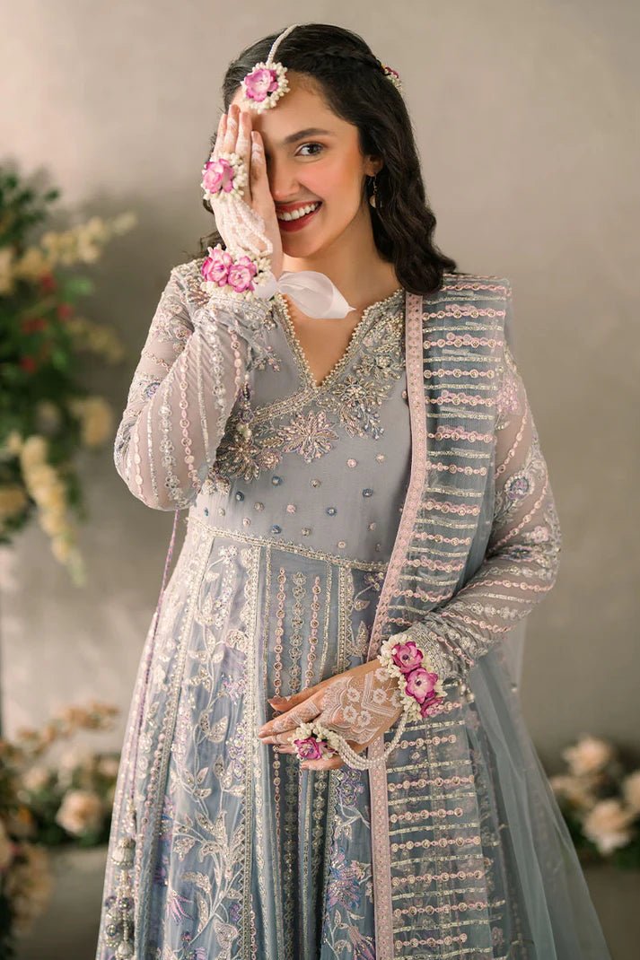 Model wearing Mushq Mastani Evening Luxury Chiffon Ezza dress in light blue with intricate embroidery, ideal for Pakistani wedding clothes online in the UK.