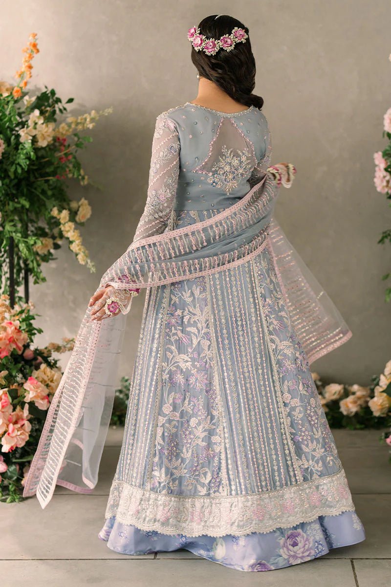 Model wearing Mushq Mastani Evening Luxury Chiffon Ezza dress in light blue with intricate embroidery, ideal for Pakistani wedding clothes online in the UK.