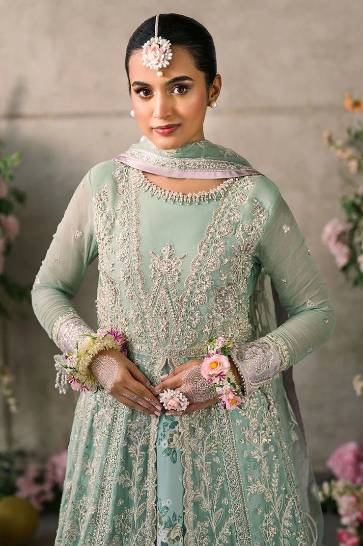 Model wearing Mushq Mastani Evening Luxury Chiffon Faiza dress in mint green with floral detailing, ideal for Pakistani wedding clothes online in the UK.