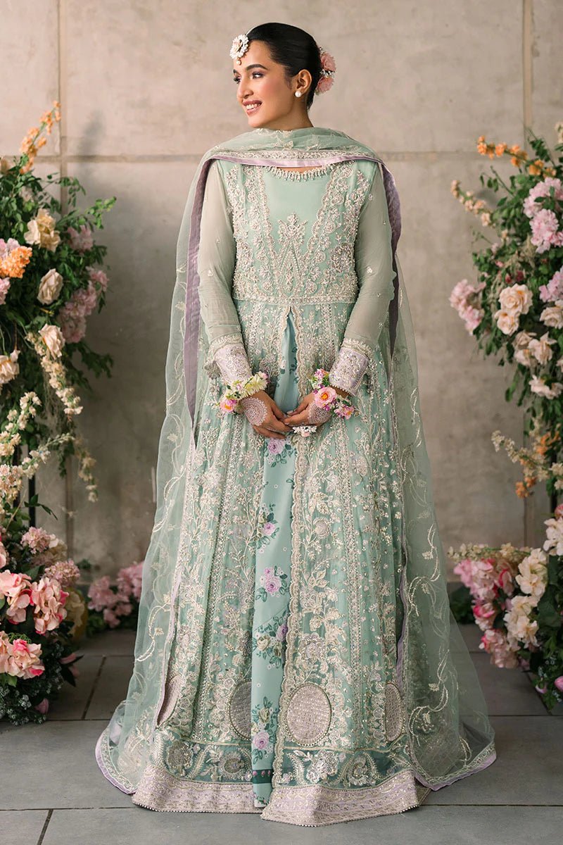 Model wearing Mushq Mastani Evening Luxury Chiffon Faiza dress in mint green with floral detailing, ideal for Pakistani wedding clothes online in the UK.